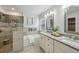 Bathroom features a double sink vanity, soaking tub, and glass enclosed shower at 4662 Creekside Villas Se Way, Smyrna, GA 30082