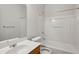 Clean bathroom featuring a vanity, mirror, toilet, and shower-tub combination for a functional space at 4662 Creekside Villas Se Way, Smyrna, GA 30082