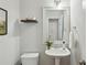 Bathroom with a white vanity, white commode, and an ornate framed mirror at 4662 Creekside Villas Se Way, Smyrna, GA 30082
