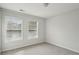 Neutral bedroom with carpeted floors and ample natural light at 4662 Creekside Villas Se Way, Smyrna, GA 30082