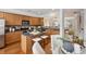 Updated kitchen featuring stainless steel appliances, granite countertops, and a breakfast bar at 4662 Creekside Villas Se Way, Smyrna, GA 30082