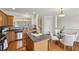 Bright kitchen with wooden cabinets, granite countertops, an island, and stainless steel appliances at 4662 Creekside Villas Se Way, Smyrna, GA 30082