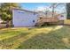 Exterior view of a home features a deck overlooking the lawn at 8331 Attica Ct, Jonesboro, GA 30238