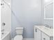 Clean bathroom features a vanity, commode, and shower over tub combination at 8331 Attica Ct, Jonesboro, GA 30238