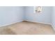 A basic bedroom features a single window and neutral carpet at 8331 Attica Ct, Jonesboro, GA 30238