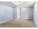 Bedroom featuring natural light, a large closet, and neutral carpet at 8331 Attica Ct, Jonesboro, GA 30238
