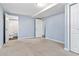 A simple bedroom includes a large walk in closet and an on-suite bathroom at 8331 Attica Ct, Jonesboro, GA 30238
