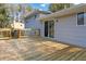 Exterior of the home features a wood deck and sliding glass doors at 8331 Attica Ct, Jonesboro, GA 30238