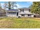 Charming split-level home with freshly painted white brick and dark shutters on a sunny day at 8331 Attica Ct, Jonesboro, GA 30238
