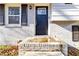Close up of updated front door, painted white brick, and black shutters add curb appeal at 8331 Attica Ct, Jonesboro, GA 30238