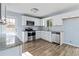 A well-lit kitchen features stainless appliances, white cabinets, and an eat-in breakfast bar at 8331 Attica Ct, Jonesboro, GA 30238