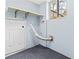 Laundry room features a window and shelving above the dryer hookup at 8331 Attica Ct, Jonesboro, GA 30238