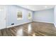 Bright living room featuring hardwood floors, neutral paint, and recessed lighting at 8331 Attica Ct, Jonesboro, GA 30238