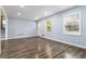 Sun-filled living room boasts hardwood floors, fresh paint, and recessed lights at 8331 Attica Ct, Jonesboro, GA 30238