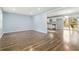 Open living space flows to kitchen with light-filled windows and hardwood floors at 8331 Attica Ct, Jonesboro, GA 30238