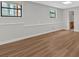 Finished basement with wood-look floors, windows for natural light, and neutral colored walls at 1117 Mountain Springs Nw Dr, Kennesaw, GA 30144