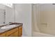 Bathroom featuring a vanity sink, mirror, and a bathtub with a shower at 1117 Mountain Springs Nw Dr, Kennesaw, GA 30144