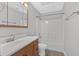 Bathroom with a shower-tub combination, vanity sink and mirror at 1117 Mountain Springs Nw Dr, Kennesaw, GA 30144