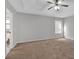 Spacious main bedroom featuring a tray ceiling, fan, neutral colors and plush carpet at 1117 Mountain Springs Nw Dr, Kennesaw, GA 30144