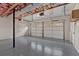 Spacious two-car garage with overhead door openers and ample storage at 1117 Mountain Springs Nw Dr, Kennesaw, GA 30144