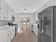 Bright kitchen with white cabinetry, stainless steel appliances, and stylish backsplash at 1117 Mountain Springs Nw Dr, Kennesaw, GA 30144