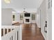 Bright living room featuring hardwood floors, a ceiling fan, and a cozy fireplace at 1117 Mountain Springs Nw Dr, Kennesaw, GA 30144