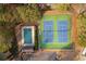 Aerial view of well-maintained tennis and pickleball courts near trees and lush greenery at 1117 Mountain Springs Nw Dr, Kennesaw, GA 30144