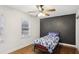 Neutral bedroom featuring a twin bed, and hardwood floors at 1524 Chateau Dr, Dunwoody, GA 30338