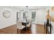 Stylish dining room with modern light fixture, comfortable chairs, and natural light at 1524 Chateau Dr, Dunwoody, GA 30338