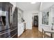 Bright wet bar area featuring a wine fridge, bar sink, and stainless steel appliances at 1524 Chateau Dr, Dunwoody, GA 30338