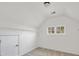 A bright attic space with carpet, a window, and shelving at 170 Maple View Ct, Dallas, GA 30157