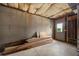 Unfinished basement with exposed insulation and stacked lumber at 170 Maple View Ct, Dallas, GA 30157