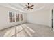 Spacious bedroom featuring tray ceiling and a large window with natural light at 170 Maple View Ct, Dallas, GA 30157