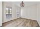 Bedroom with neutral walls, modern light fixture, and lots of natural light at 170 Maple View Ct, Dallas, GA 30157