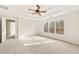 Bright bedroom with a tray ceiling, neutral carpet, and natural light from a window at 170 Maple View Ct, Dallas, GA 30157