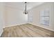 Bright dining room featuring modern lighting, neutral walls, and beautiful flooring at 170 Maple View Ct, Dallas, GA 30157