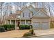 Charming two-story home with stone accents, inviting front porch and well manicured yard at 170 Maple View Ct, Dallas, GA 30157