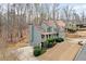 Exterior shot of the house with well-maintained landscaping and a side view of the garage and backyard at 170 Maple View Ct, Dallas, GA 30157