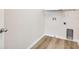 A functional laundry room with wood-look flooring and storage rack at 170 Maple View Ct, Dallas, GA 30157