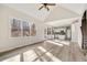 Open living room with vaulted ceiling, natural light, and view to kitchen and staircase at 170 Maple View Ct, Dallas, GA 30157