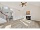 Bright living room with vaulted ceilings, fireplace, staircase, and lots of natural light at 170 Maple View Ct, Dallas, GA 30157