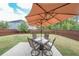 Inviting backyard with a patio dining set under a shade umbrella, perfect for outdoor entertaining at 1935 Azure Grove Ct, Marietta, GA 30008