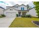 Charming two-story home with white siding, well-manicured lawn, and a cozy front porch at 1935 Azure Grove Ct, Marietta, GA 30008