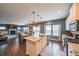 Open kitchen featuring stainless steel appliances, granite counters, and wood flooring at 1935 Azure Grove Ct, Marietta, GA 30008