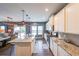 Open kitchen with stainless steel appliances, granite countertops, and an island at 1935 Azure Grove Ct, Marietta, GA 30008