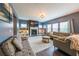 Comfortable living room with built-in shelves, a fireplace, a TV, and two sofas for comfortable seating at 1935 Azure Grove Ct, Marietta, GA 30008