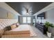 Spacious bedroom with a large bed, dark tray ceiling, ceiling fan, and great natural lighting at 1935 Azure Grove Ct, Marietta, GA 30008