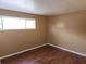 Small bedroom with hardwood floors and natural light at 2722 Penwood Pl, Lithonia, GA 30058