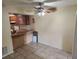 Cozy dining area shows bar seating to kitchen and ceiling fan with light at 2722 Penwood Pl, Lithonia, GA 30058