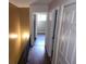 Upstairs hallway features wood floors and multiple bedrooms at 2722 Penwood Pl, Lithonia, GA 30058